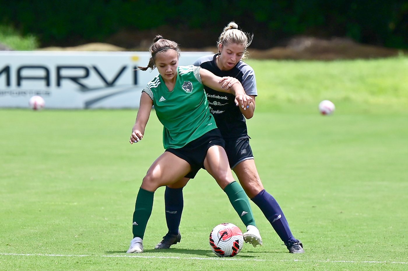 Players competing for the ball during a match in Costa Rica