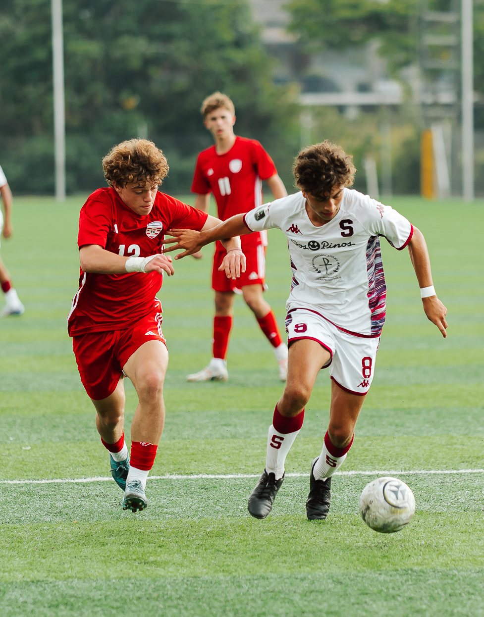 Players competing for the ball during an international match