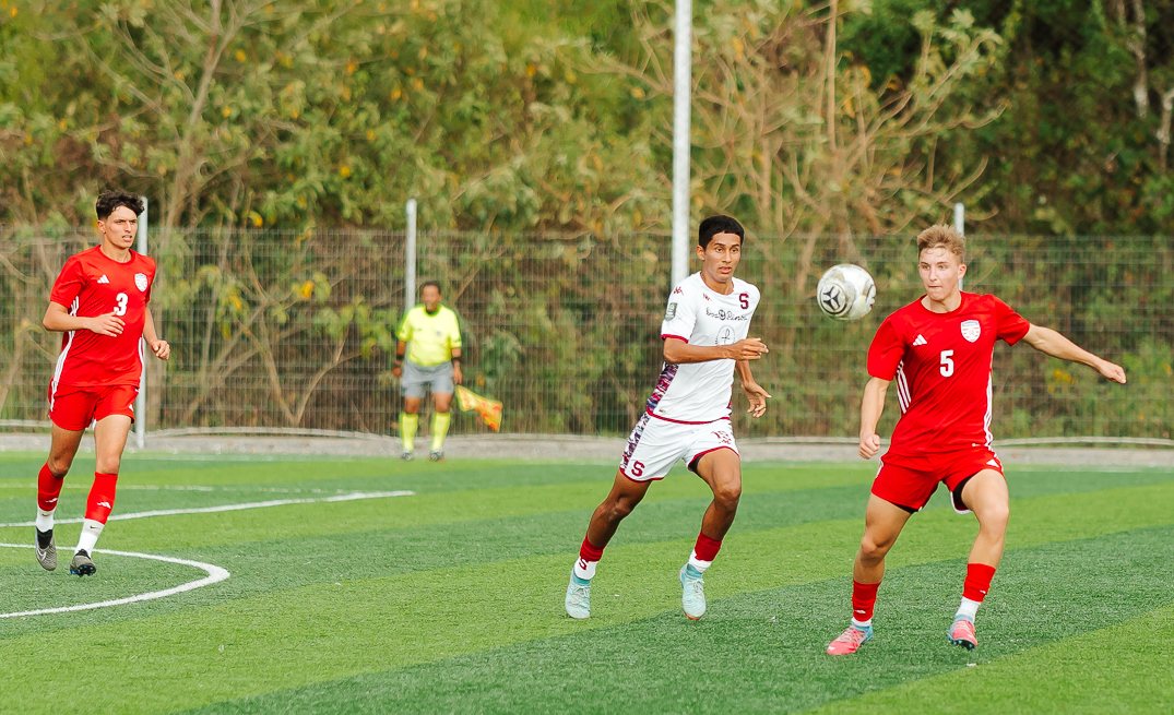 Players competing for the ball during an international match